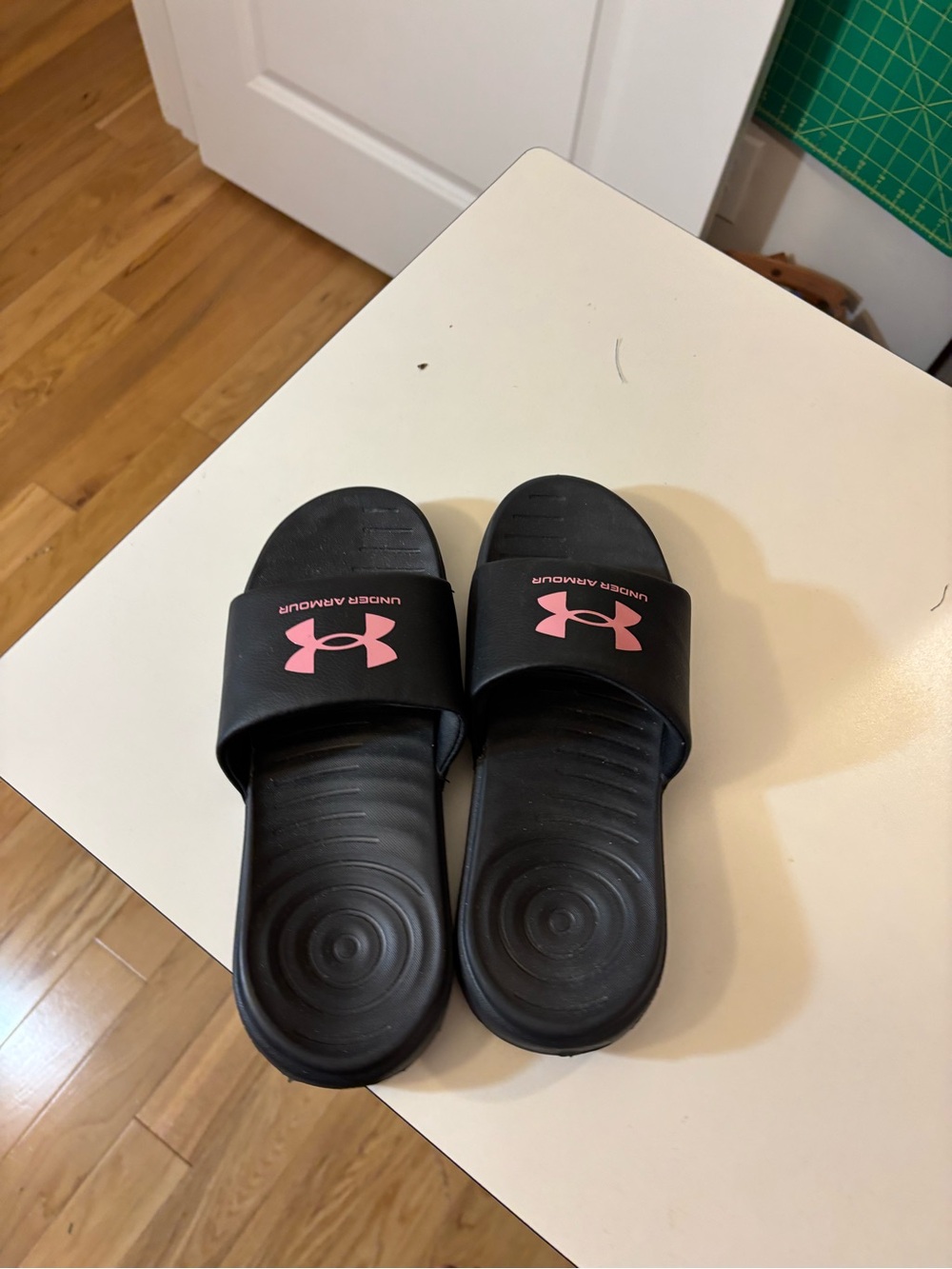 Under Armour Women’s Black Slide Sandals with Pink Logo